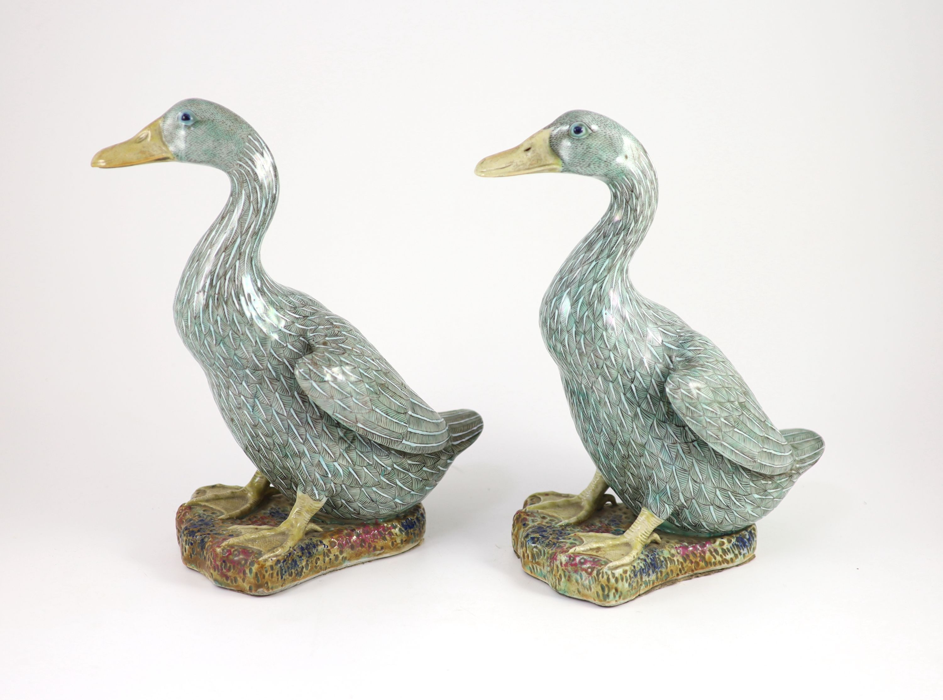 A pair of Chinese famille verte enamelled porcelain models of ducks, 19th century, 30.5 cm high